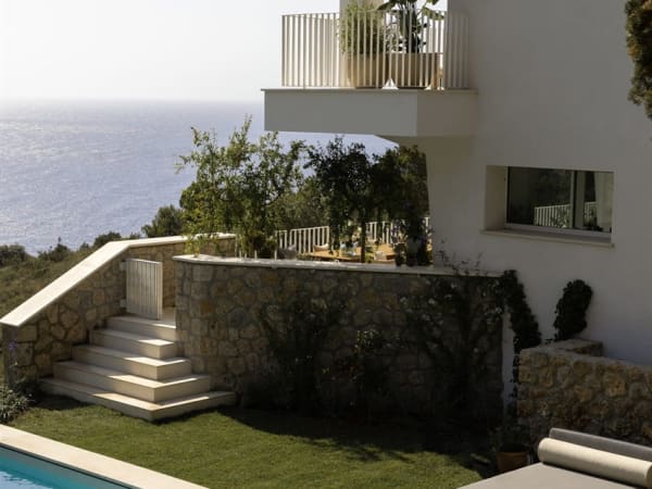 Steps leading down from the main terrace to the pool area.